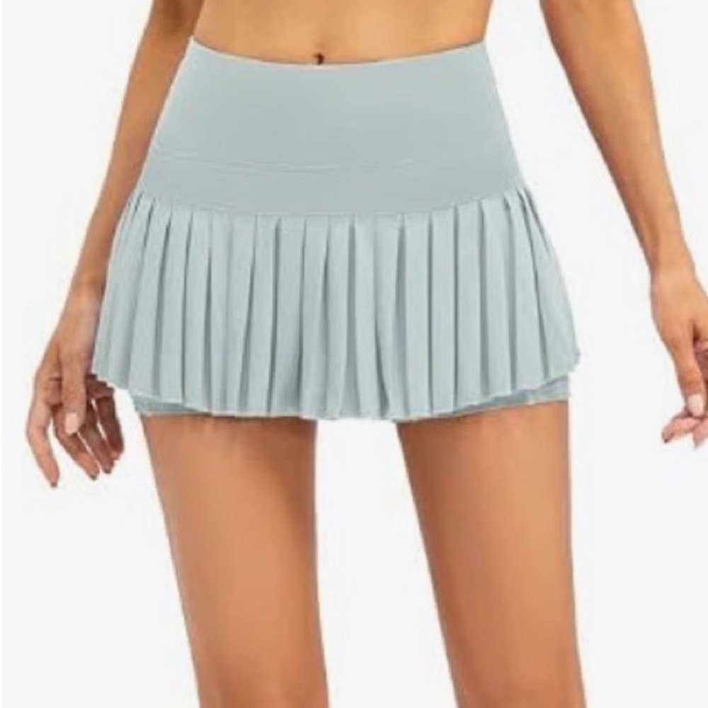 Light blue/teal pleated tennis skirt with shorts underneath